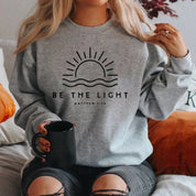 Erica | Cozy Fit Be The Light Inspirational Women's Sweatshirt